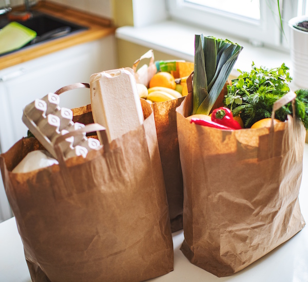 groceries Groceries in bags on a kitchen counter